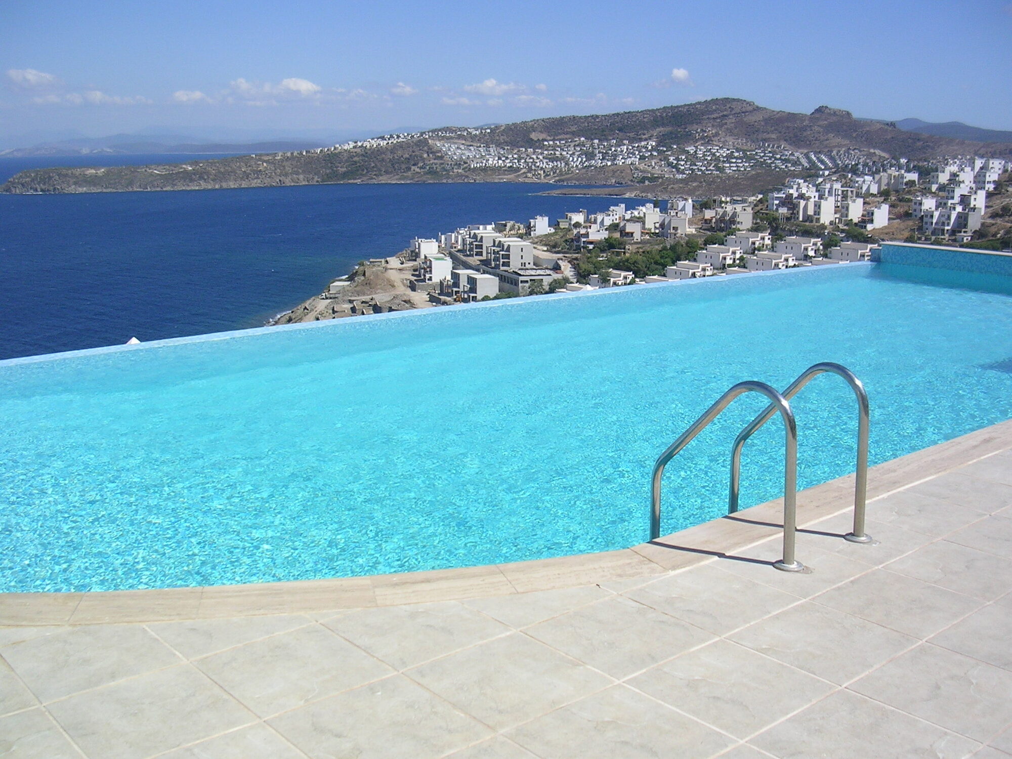 Herodot Villas' communal infinity pool with the bay beyond