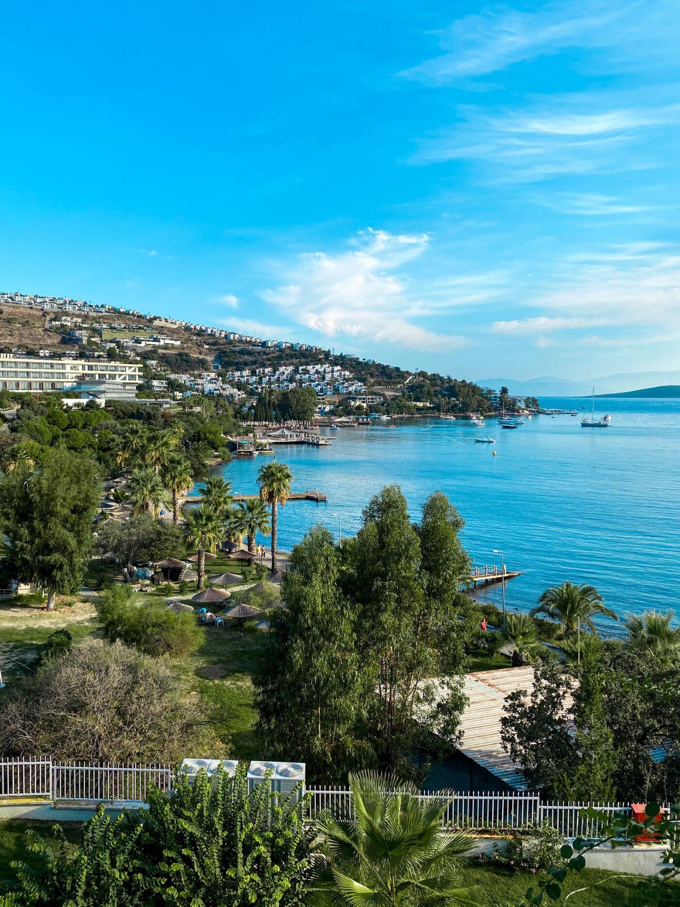 White hillside houses above a turquoise bay on the Bodrum peninsula