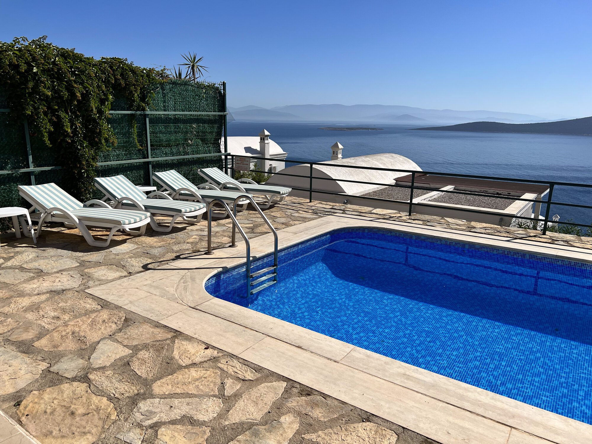 The private pool of Villa Mia with an uninterrupted view across Gündoğan bay to the islands