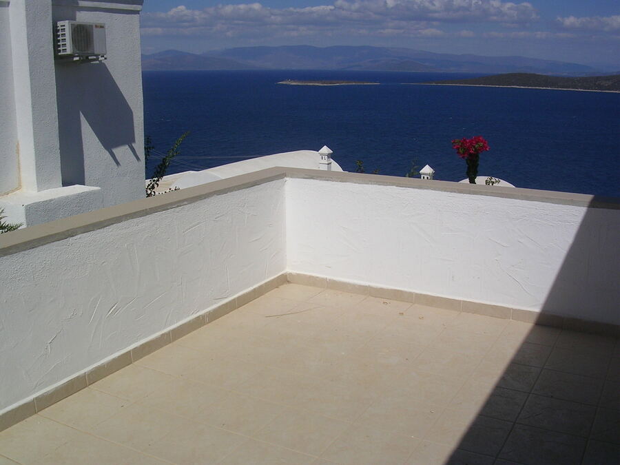 The upper terrace of the villa looking out over the blue of Gündoğan bay