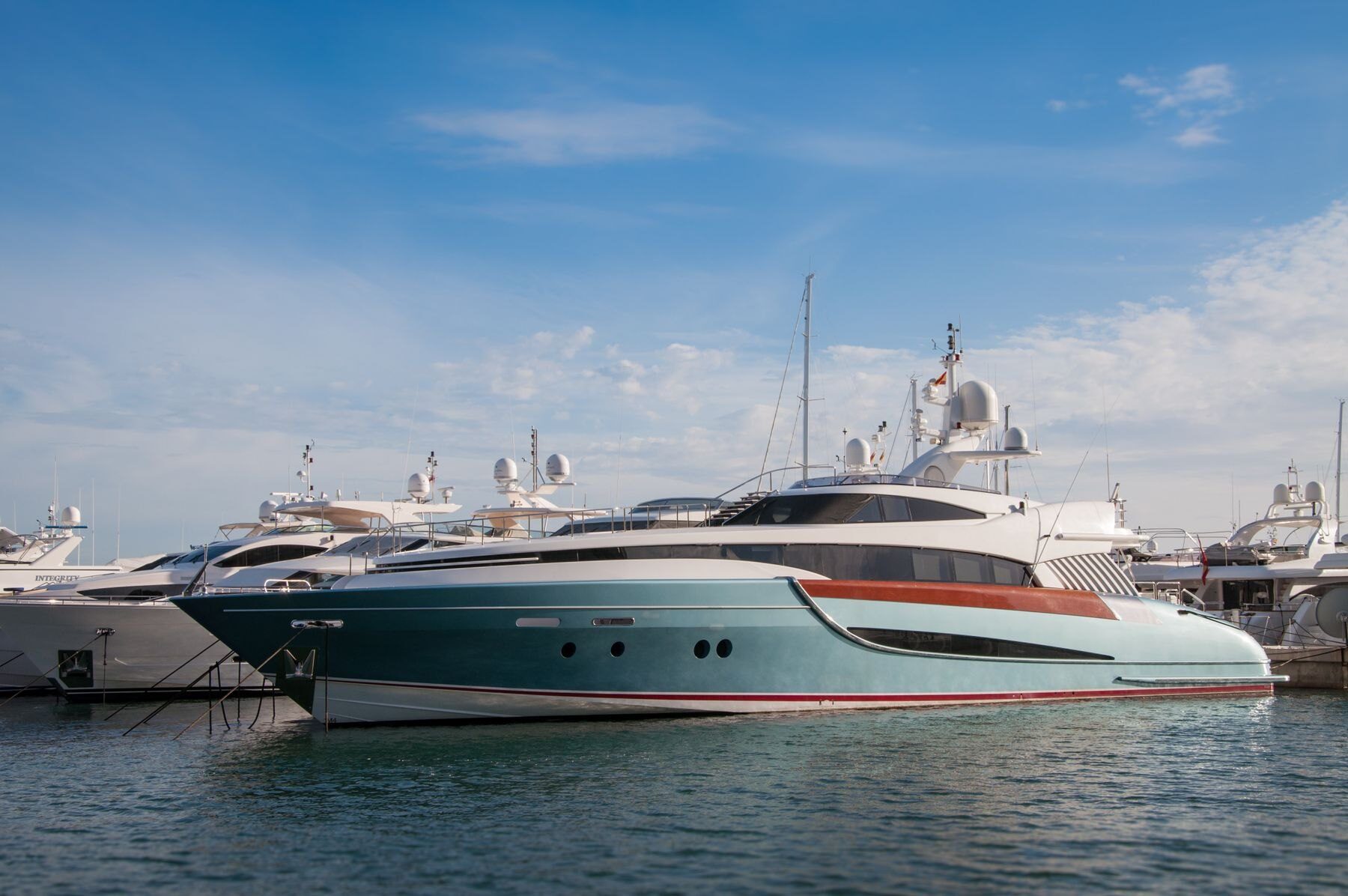 A sleek modern superyacht at the quay
